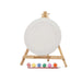 Art & Magic Round Canvas Painting Set with pastel colors, including a round canvas, wooden easel, six pastel paints, and a paintbrush for gentle-hued art projects.


