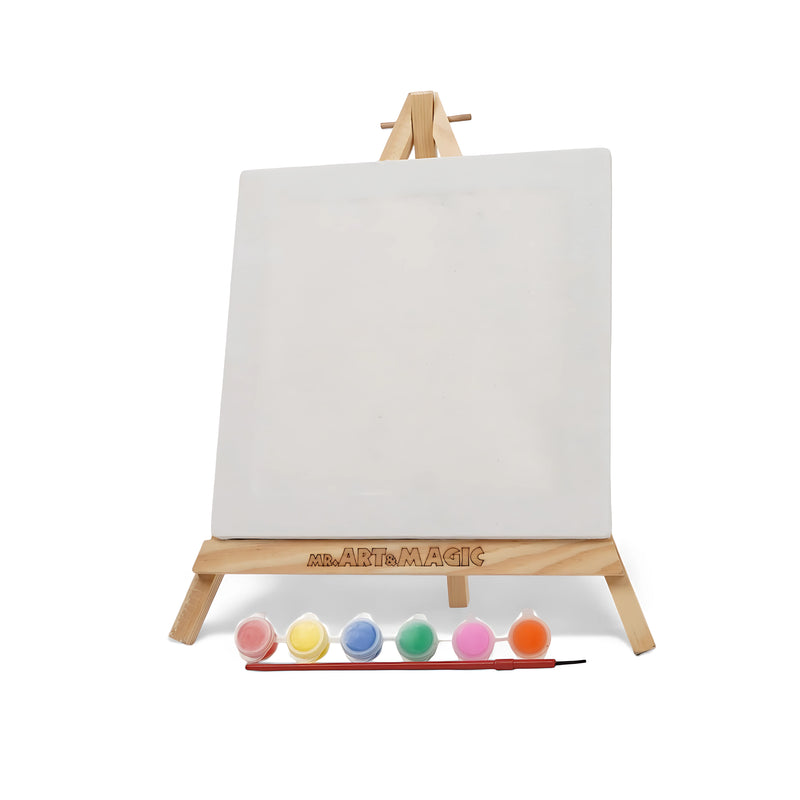 Art & Magic Square Canvas Painting Set with pastel colors, featuring a square canvas, wooden easel, six pastel paints, and a paintbrush for soft-colored art projects.

