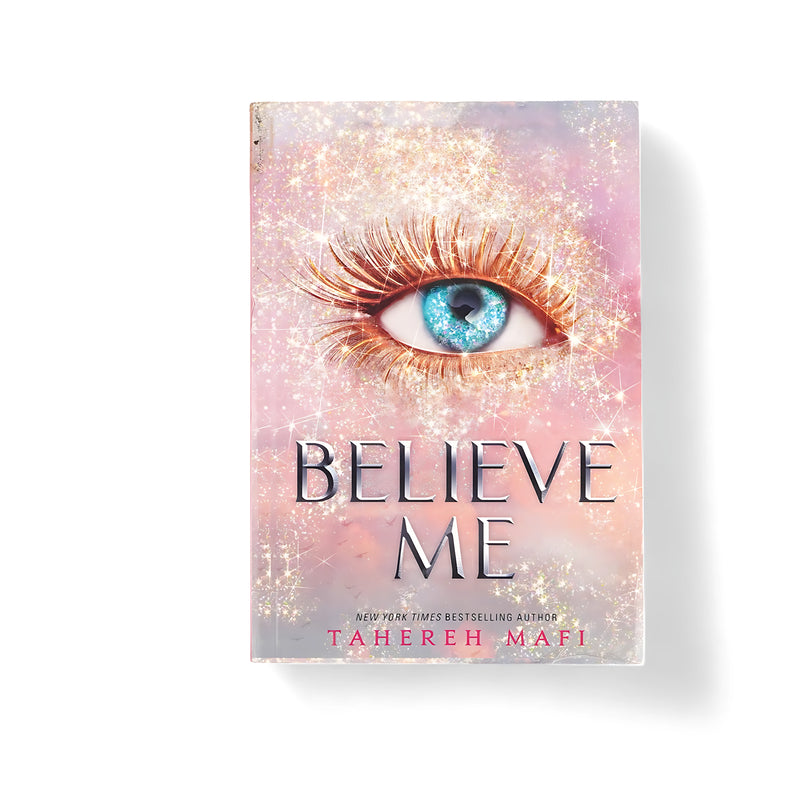 Cover of Believe Me by Tahereh Mafi, featuring a surreal blue eye framed by sparkling lashes and set against a dreamy, pastel-colored background.

