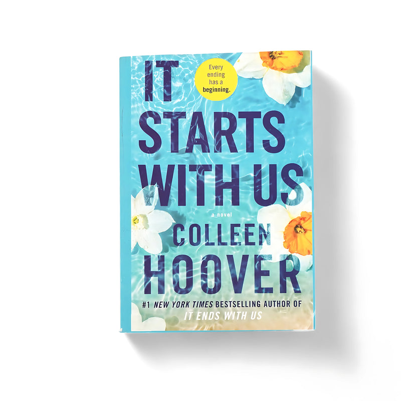 Cover of It Starts With Us by Colleen Hoover, featuring white and yellow flowers floating in water, symbolizing renewal and emotional healing.






