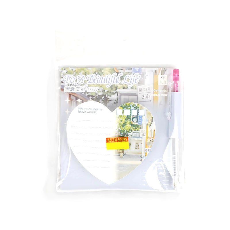 "To a Beautiful Life" memo pad set featuring heart-shaped pages with scenic illustrations and a matching pen, packaged in a transparent plastic holder.

