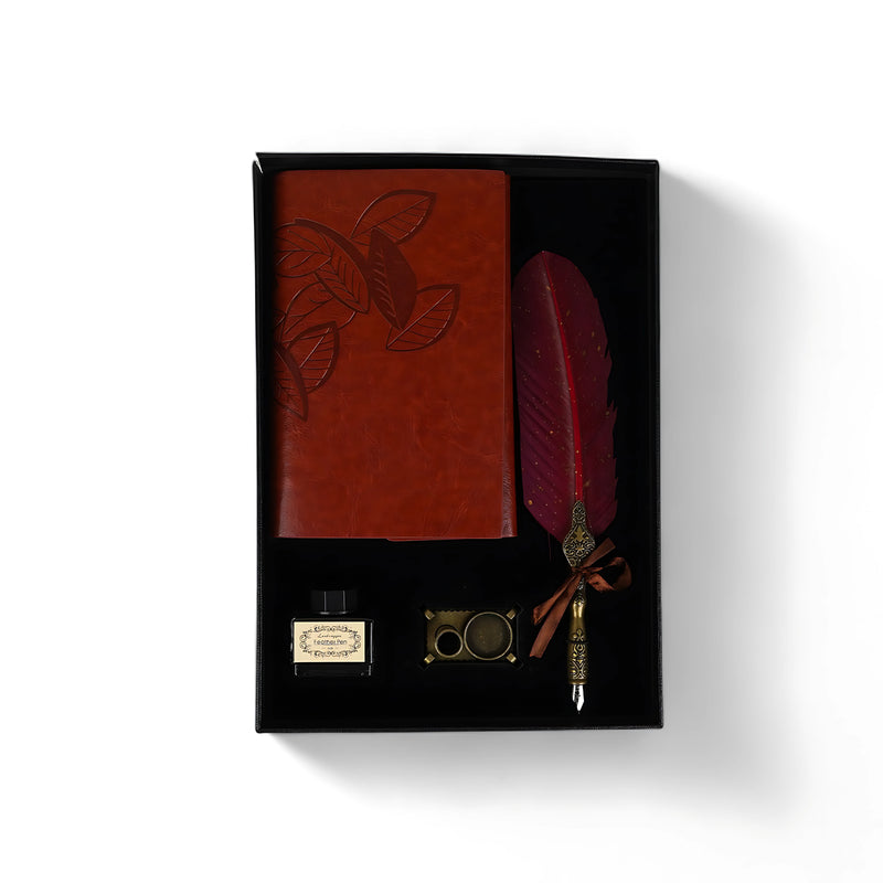 Vintage Red Feather Pen & Embossed Journal Set in black gift box, featuring a red feather pen, leather journal, ink bottle, and wax seal holder.

